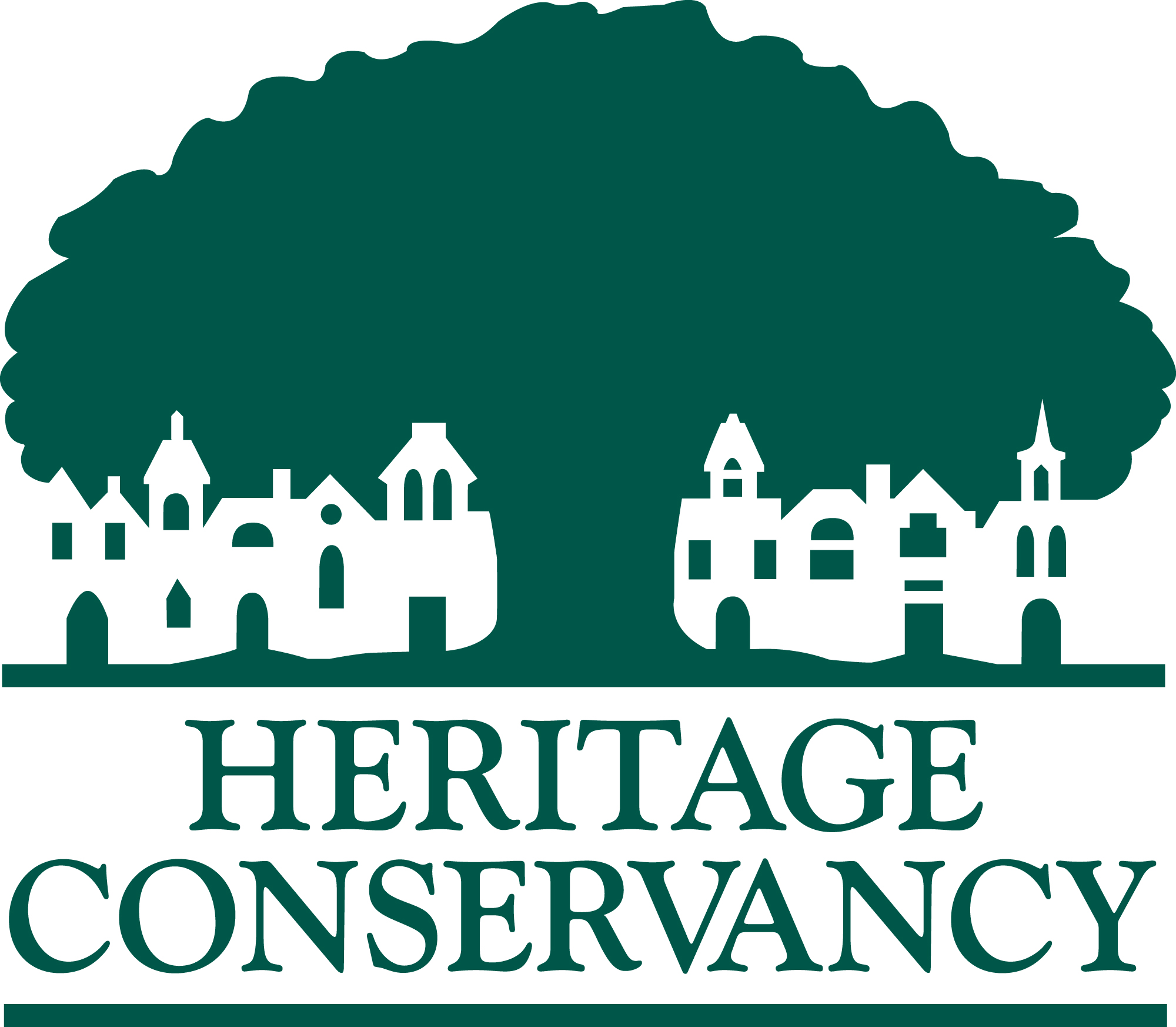 the heritage conservancy logo, green text displays the company name below a tree of the same color. an outline of buildings is in front of the tree.